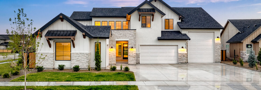 Beautiful white home with lush grass and RV garage